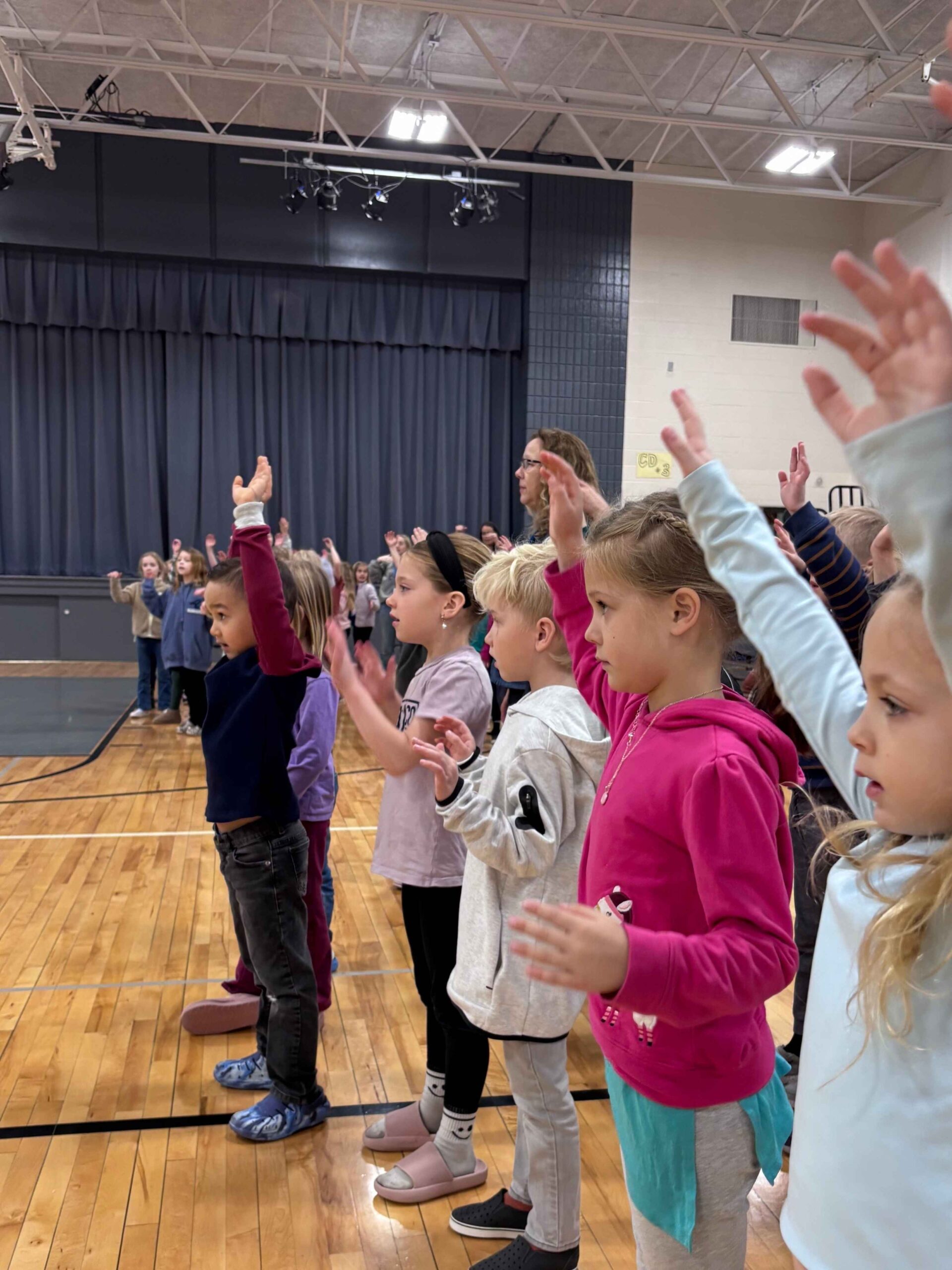 Elementary students participating in praise and worship at West Side Christian School